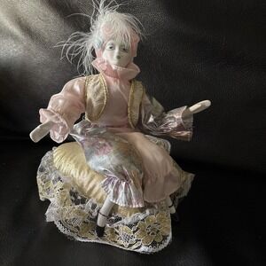 Vintage Porcelain Clown Jester Music Box Sitting on Gold Pillow 8 Inch Poseable